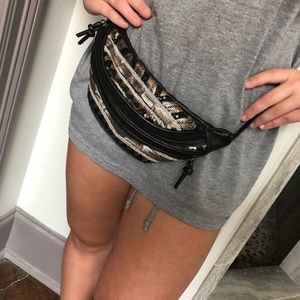 Black, gold, and silver Fannie pack from The Icing